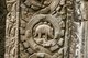 Cambodia: One of Angkor's mysteries, a dinosaur roundel (looking like a stegosaurus) on a pillar in Ta Prohm, Angkor